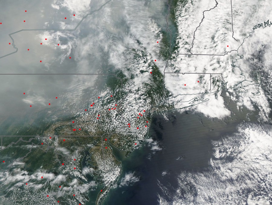 Every red dot is the location of a satellite-indicated fire; these dots are superimposed onto the current satellite view, which itself has plenty of smoke over it from the Canadian fires. Image: NASA 