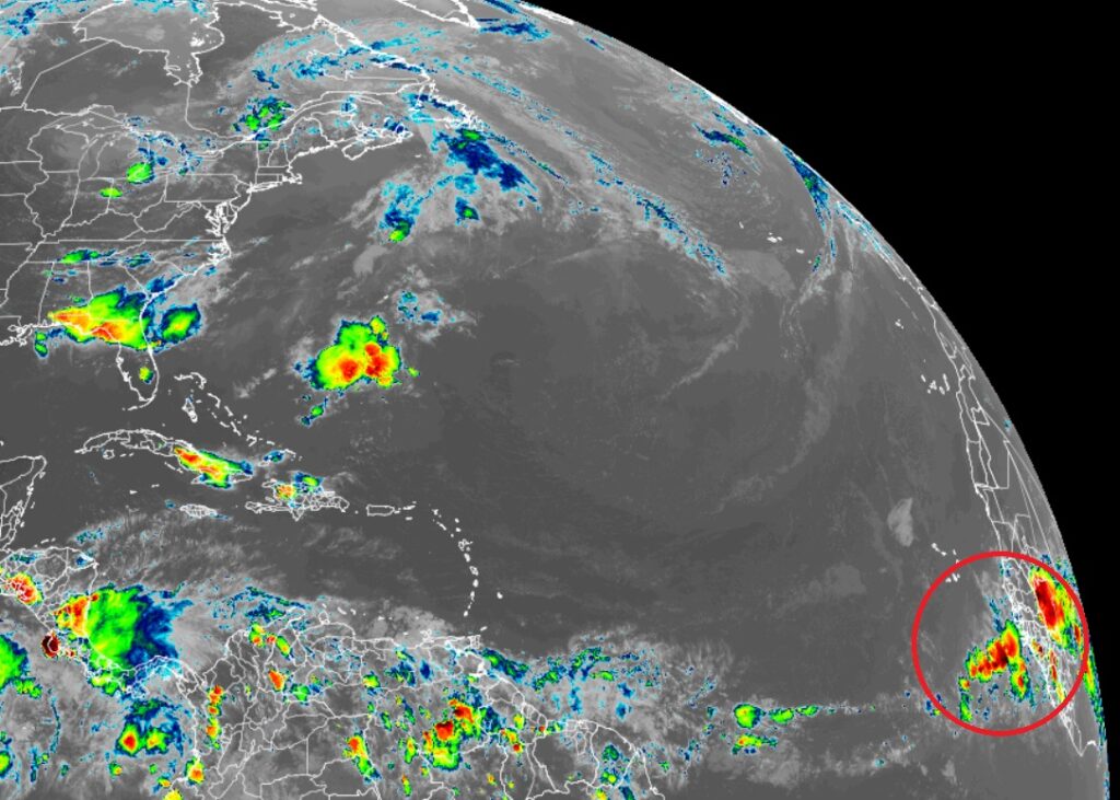 The circled area on this current GOES-East weather satellite view shows the area the National Hurricane Center is monitoring for tropical cyclone development. Image: NOAA
