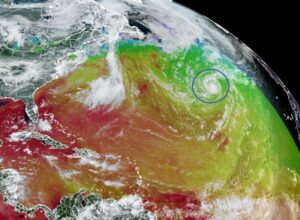 This view of Tropical Storm Don over the Atlantic from the GOES-East satellite combines a standard satellite picture with a map reflecting current sea surface temperatures, with reds and oranges warm and greens and blues cold. Image: NOAA