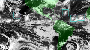 The Hurricane Analysis and Forecast System (HAFS) “moving nest" Model. Global map showcasing land mass in green and water in black, clouds in white and tropical storms outlined in a green boxes representing the moving nest model. Image: NOAA