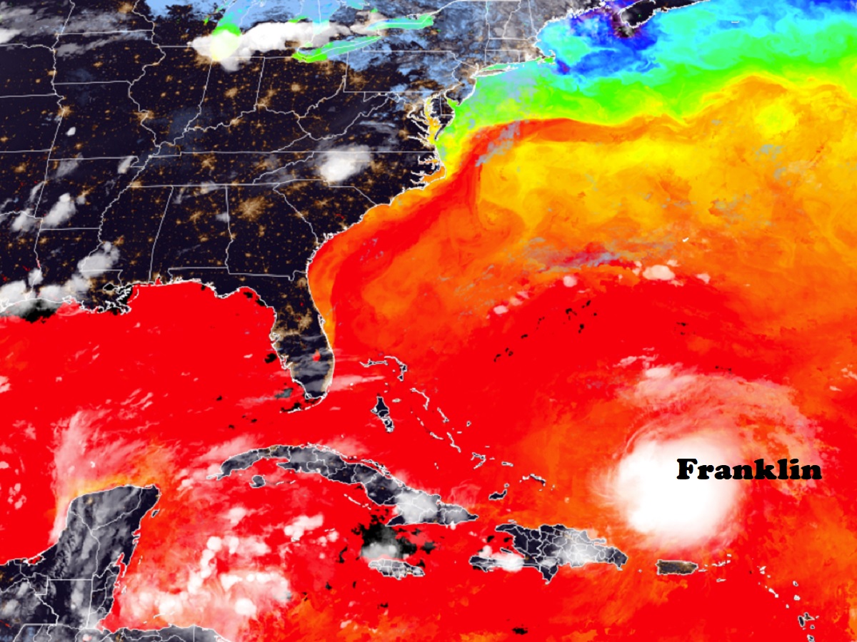 This color-enhanced satellite view reflects water surface temperatures with clouds on top and shows how Franklin is moving through an area of very warm water which it'll use as fuel to become stronger. Image: NOAA