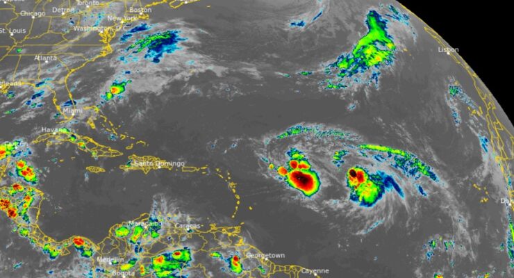 The latest view from the GOES-East weather satellite shows Tropical Storms Philippe, Left, and Rina, Right, in the open waters of the Atlantic east of the Northern Leeward Islands. Image: NOAA