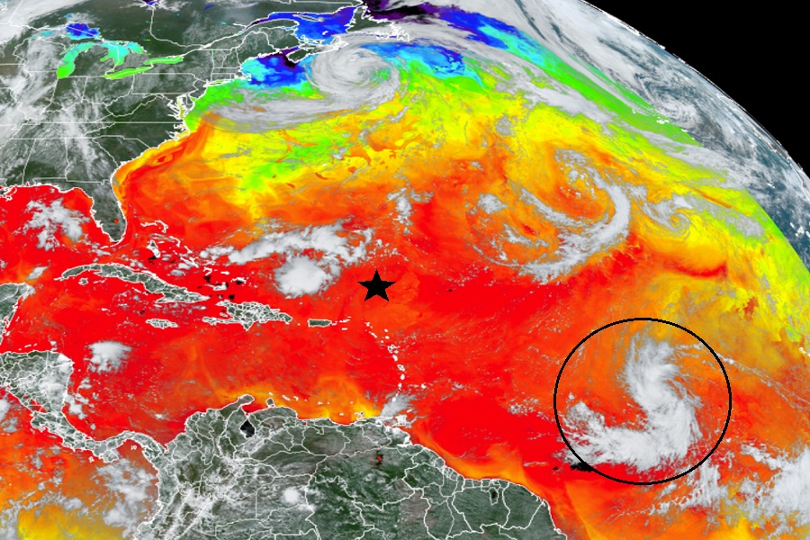 This view of the Atlantic from the GOES-East weather satellite shows tropical depression #13 circled while the star illustrates where it is expected to be by Sunday morning. Sea surface temperatures on this map, with reds and oranges reflecting warmer readings while blue and green reflect colder, show conditions ripe for significant development of this system over the next several days. Image: NOAA
