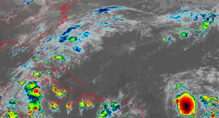 Philippe, shown as the intense storm in red on this latest GOES-East weather satellite view, could impact Puerto Rico and the Virgin Islands over time. Image: NOAA