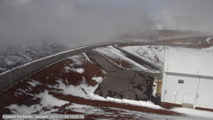Current view of the cat walk at the Suburu Telescope atop Mauna Kea shows snow on the ground, but roads now free of snow which fell earlier today from the Kona Low. More snow is expected tonight into tomorrow morning. Image: Subaru Telescope / Mauna Kea