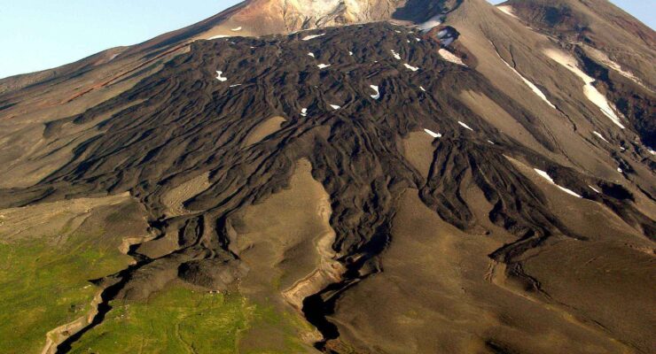 File photograph of the Gareloi Volcano. Levied lava flows from a 1980s eruption drape the south flank of the southern summit crater. Image: USGS / McGimsey R.G.