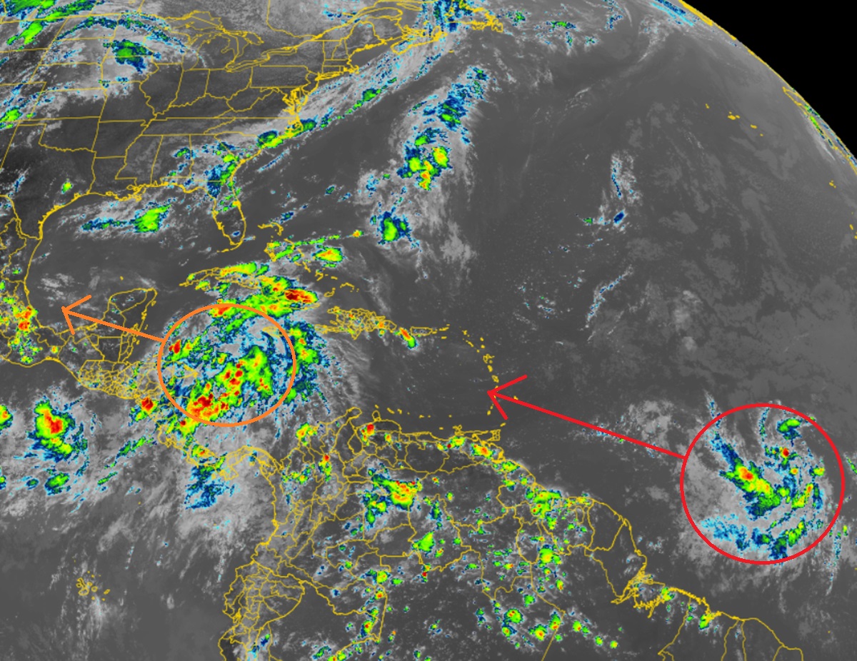 The latest satellite images show two circled areas of concern being monitored in the tropics;  the red area has the highest chance of becoming a tropical storm.  Image: NOAA