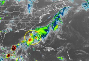 Current GOES-East weather satellite shows an area circled in yellow being monitored by the National Hurricane Center for possible tropical cyclone development. Image: NOAA