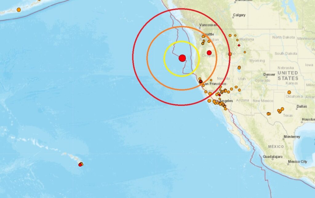 This map shows where all earthquakes have struck within the last 24 hour, with the largest striking off the coast of Oregon inside the colored concentric circles.  Image: USGS