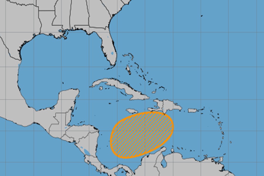 The area shaded in orange is being monitored by the National Hurricane Center for possible tropical cyclone development.  Image: NHC