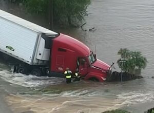Texas Game Wardens perform a search and rescue mission with a tractor trailer swept away by flood waters in Texas. Image: Texas Game Wardens