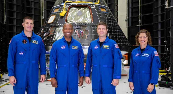 The Artemis II crew is shown inside the Neil Armstrong Operations and Checkout Building at NASA’s Kennedy Space Center in Florida in front of their Orion crew module on Aug. 8, 2023. From left are: Jeremy Hansen, mission specialist; Victor Glover, pilot; Reid Wiseman, commander; and Christina Hammock Koch, mission specialist. Image: NASA / Kim Shiflett