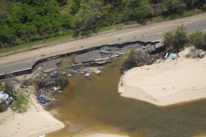 Thousands of homes and businesses were damaged or destroyed by heavy rain and strong winds by recent Kona Low storms; even roadways, like the one pictured here on Oahu, was damaged by the storms. Image: County of Honolulu