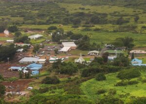 An aerial view of communities overwhelmed by mud and boulders brought down the hillside by rain that was measured in feet from Hurricane Lala. Image: Governor Josh Green