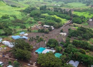 The town of Nāʻālehu is burried under thick mud and boulders delivered from flood waters that raced through the region at the height of Hurricane Lala in the district of Ka‘ū . The top middle area is where the Nāʻālehu Cemetary was; the blue-green roof in the lower middle is where Punalu‘u Bake Shop is. Image: Governor Josh Green
