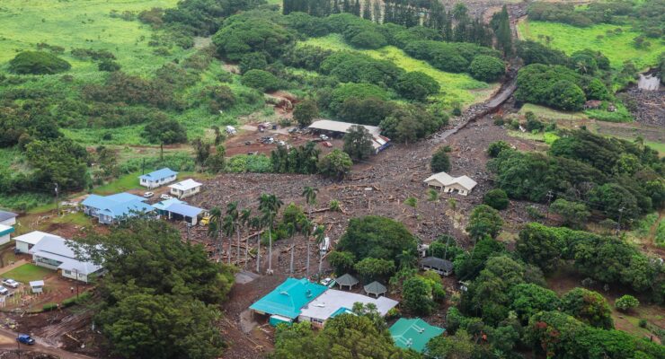 The town of Nāʻālehu is burried under thick mud and boulders delivered from flood waters that raced through the region at the height of Hurricane Lala in the district of Ka‘ū . The top middle area is where the Nāʻālehu Cemetary was; the blue-green roof in the lower middle is where Punalu‘u Bake Shop is. Image: Governor Josh Green