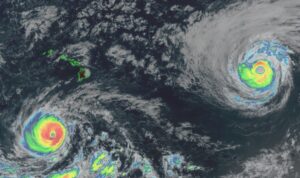 The latest GOES-West weather satellite view shows Hurricanes Lowell, left, and Karina, right, approaching Hawaii. Image: NOAA