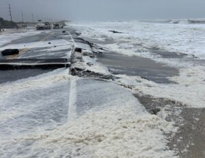 The developing coastal storm has already created flooding issues and beach erosion along the east coast, including here on NC12 near the Pea Island Visitor's Center on the North Carolina coast. Image: North Carolina Department of Transportation